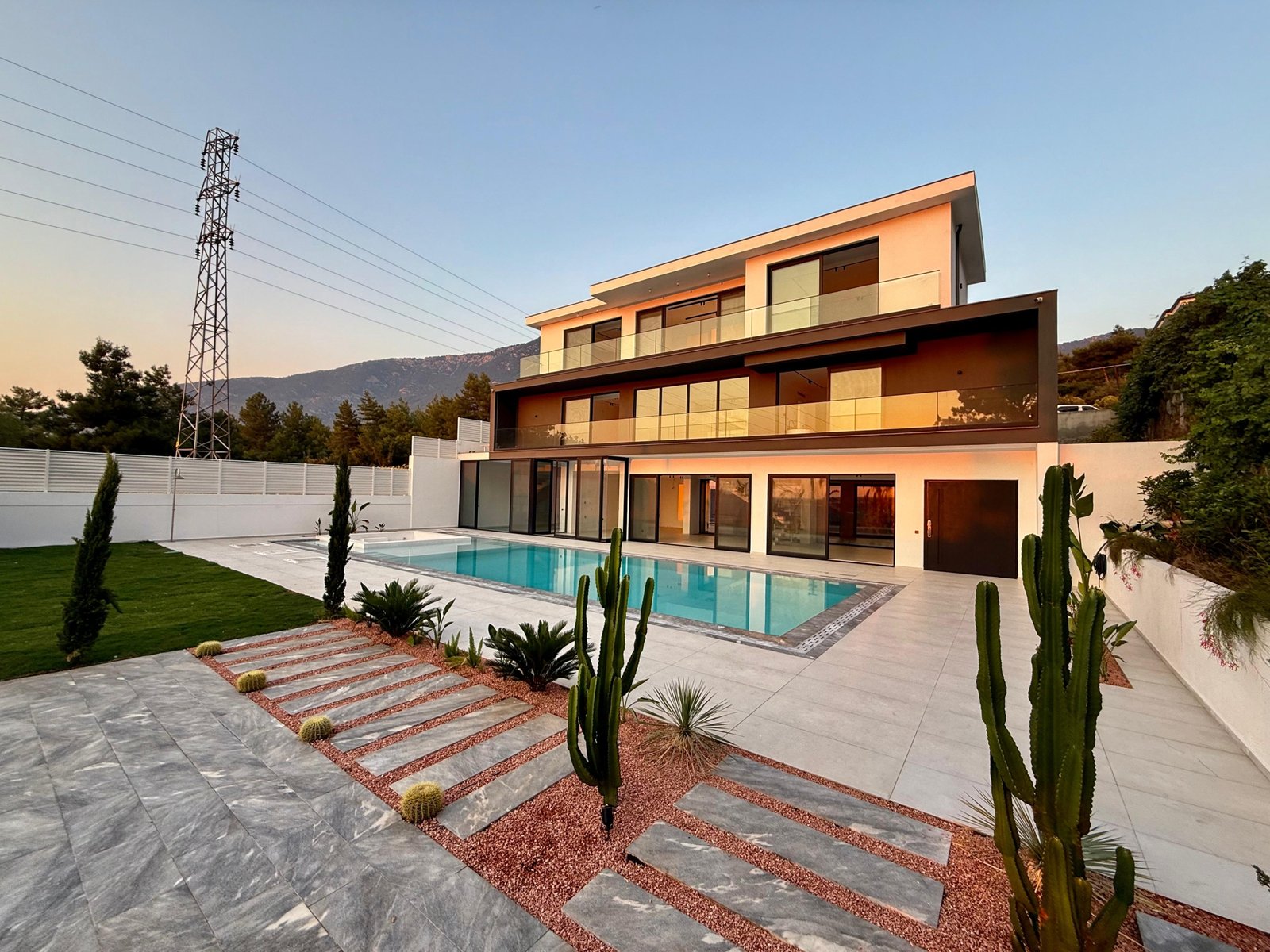 Modern villa in Ovacık Fethiye with private pool, fire pit lounge, and landscaped garden