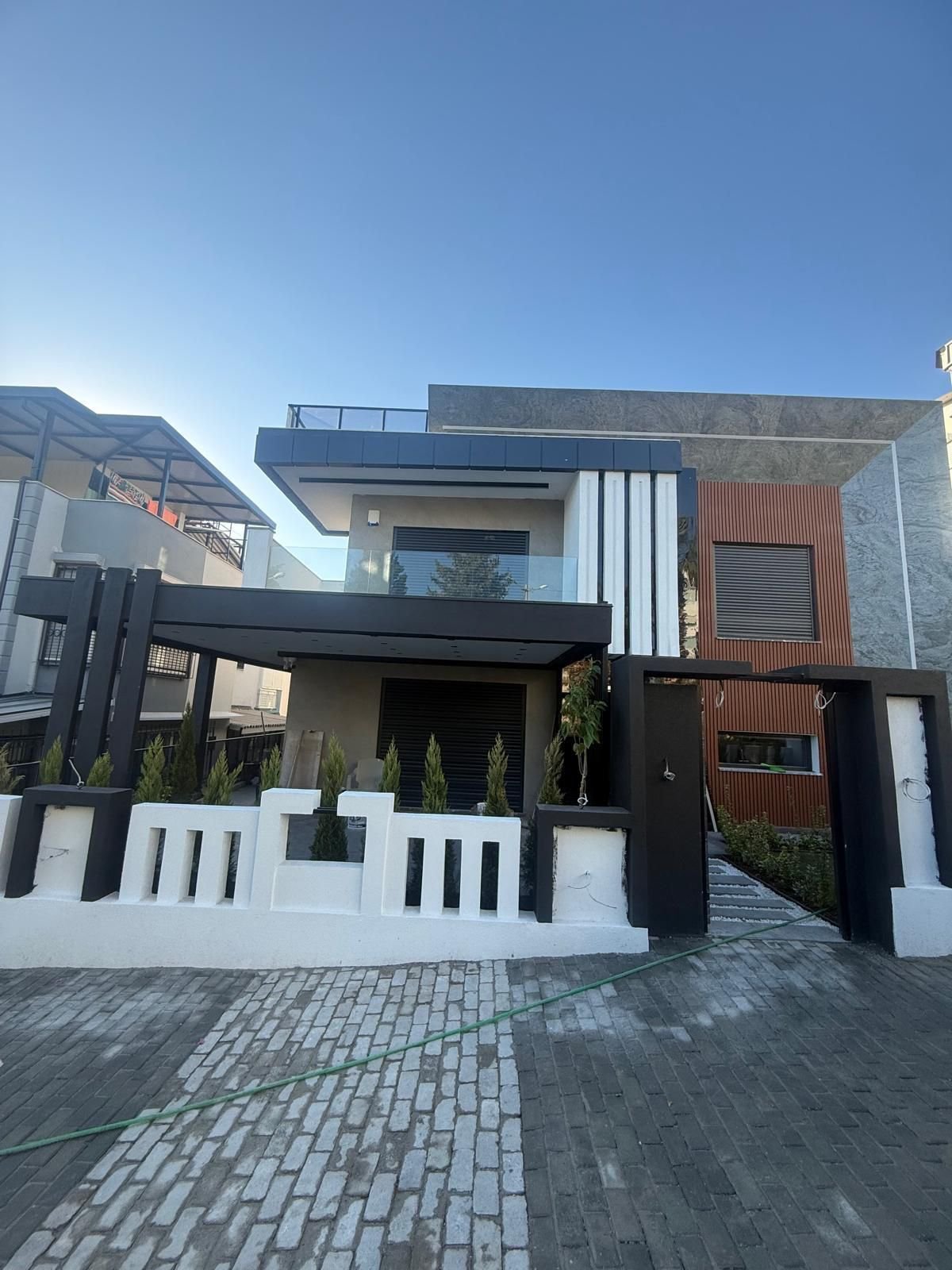 Luxury 3+1 triplex villa for sale in Kuşadası with private pool and panoramic sea view.