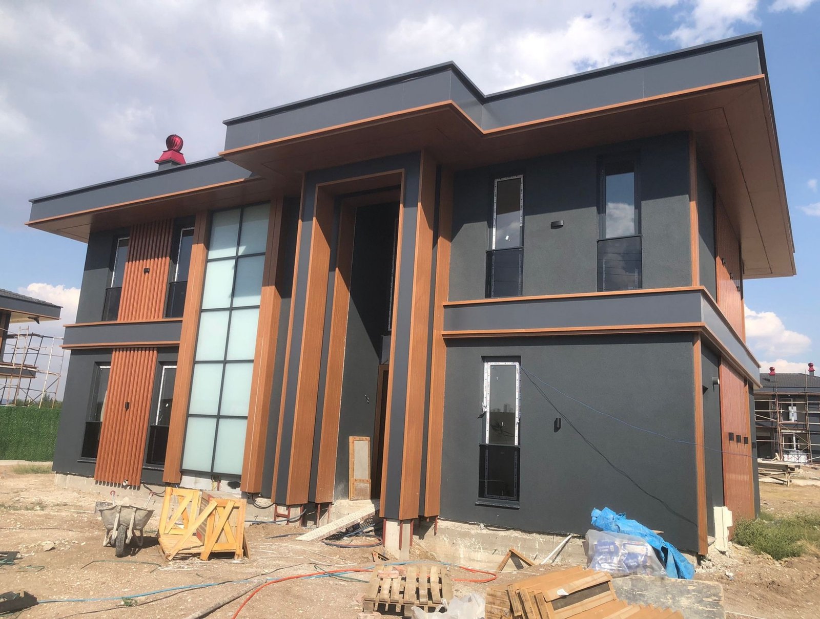 Double-height dining room interior with 6.67-metre ceilings in this exclusive luxury villa project, Ankara.